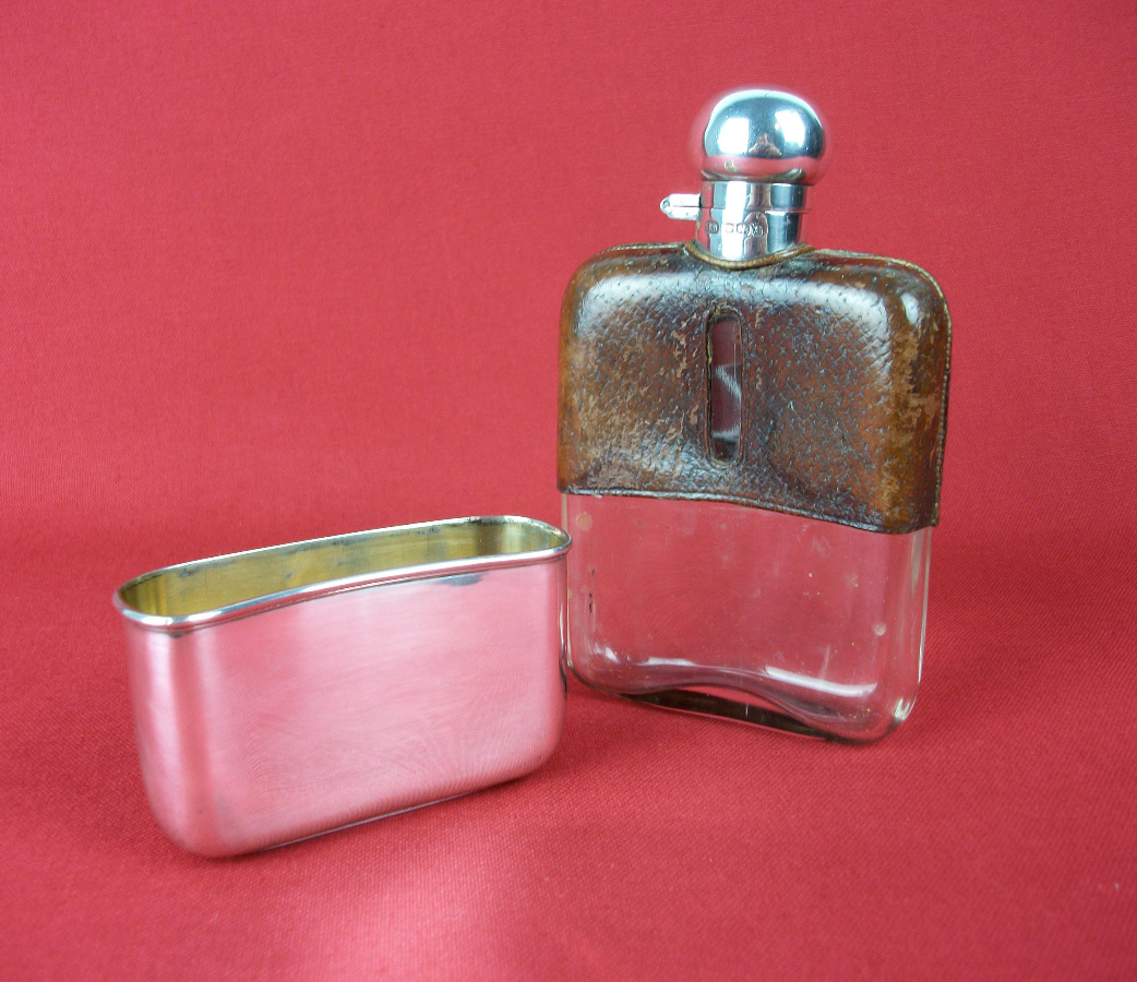 silver and leather bound hip flask